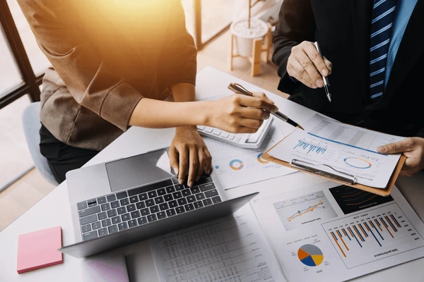 financial analysts analyze business reports 600nw 2283414737